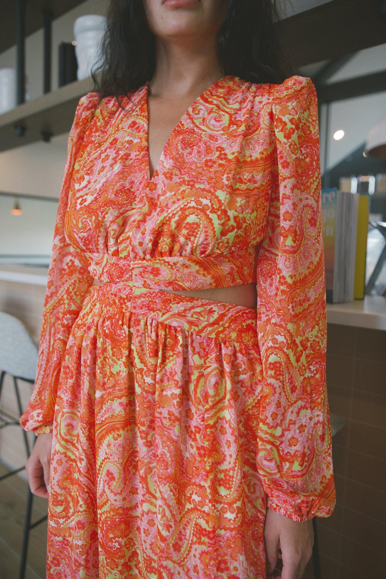 orange paisley long sleeve maxi dress with side cut outs, open back and front slit