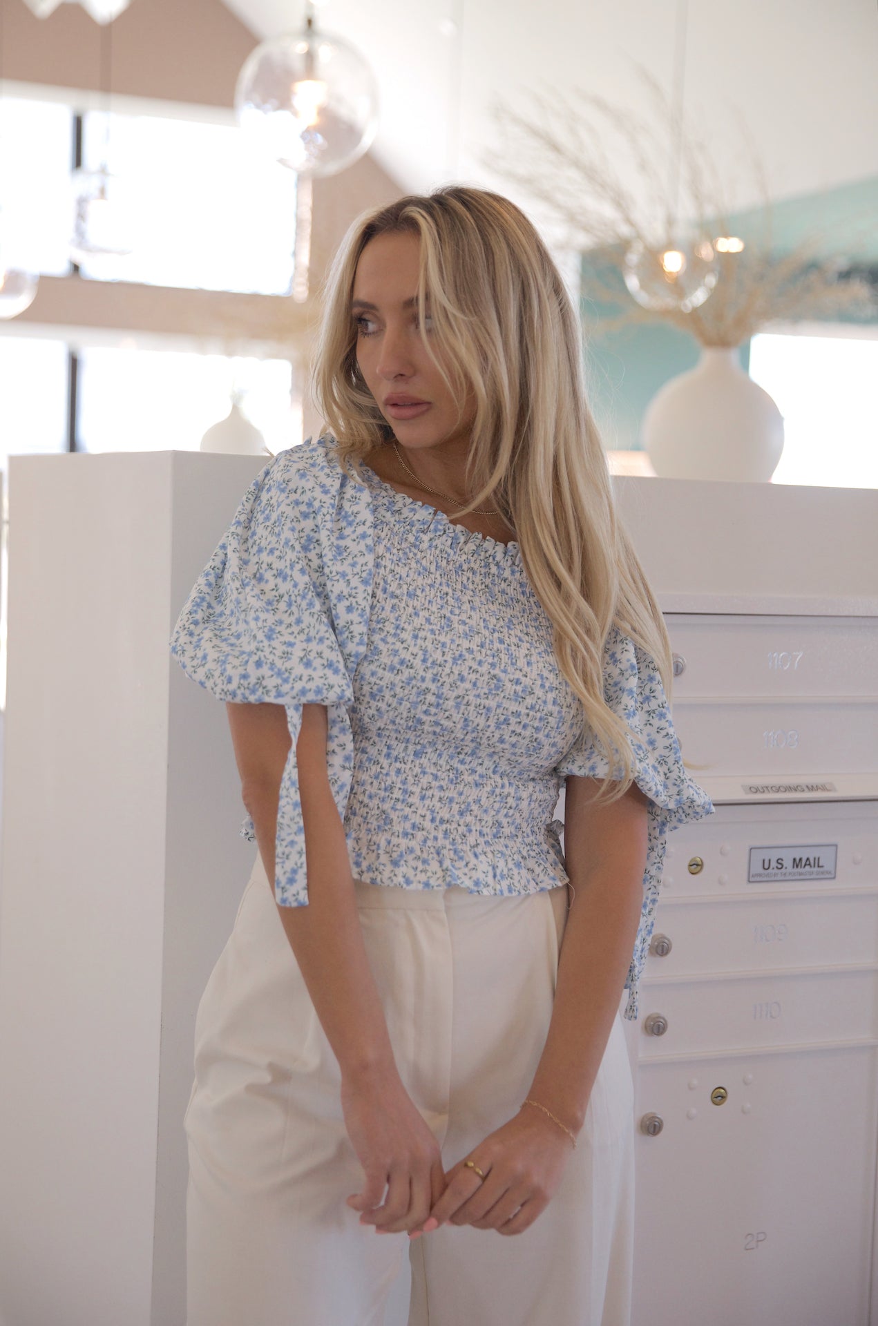 white and blue floral smocked crop top with puff sleeves