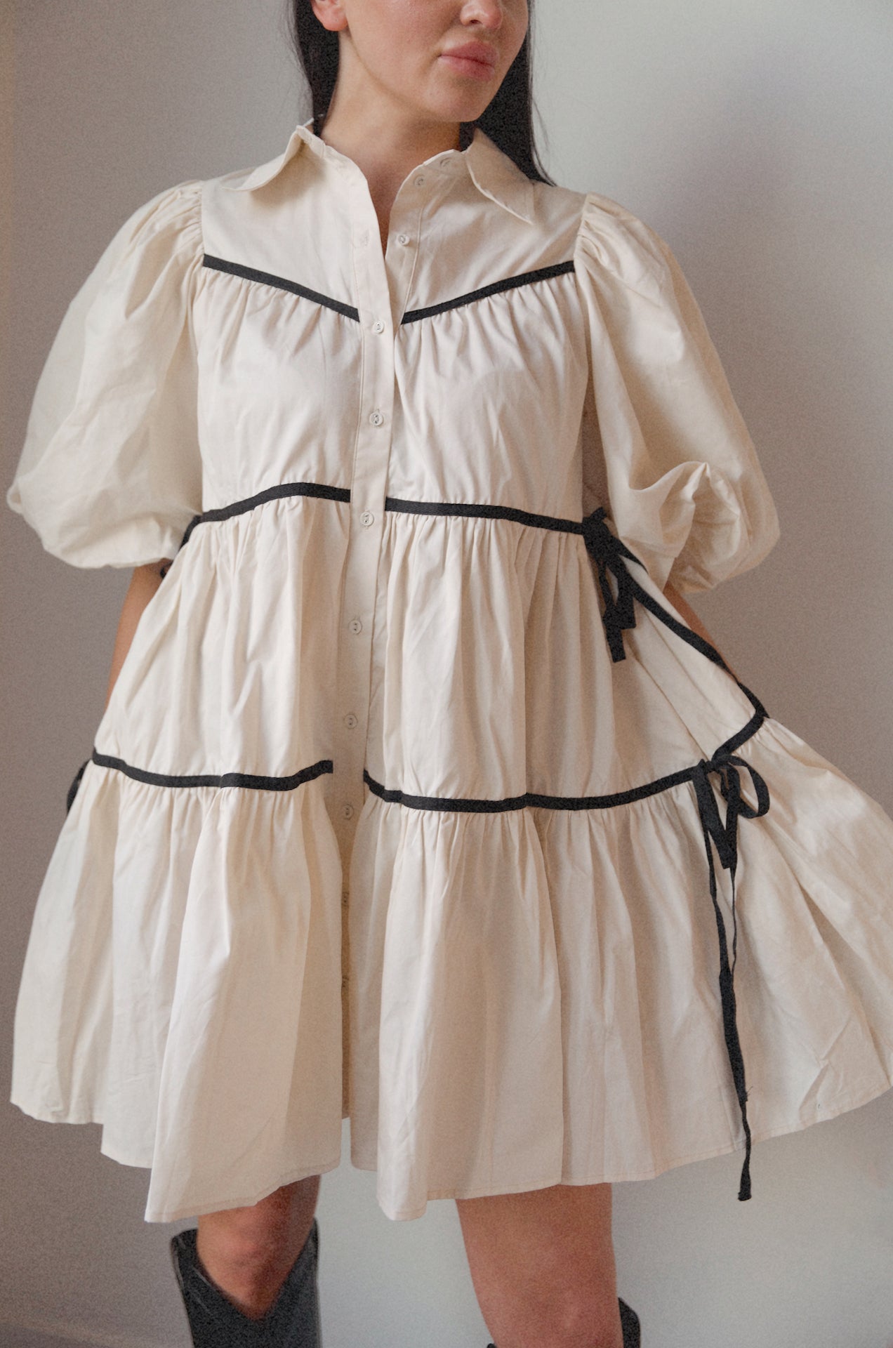 cream collared puff sleeve babydoll dress with side bow tie detail