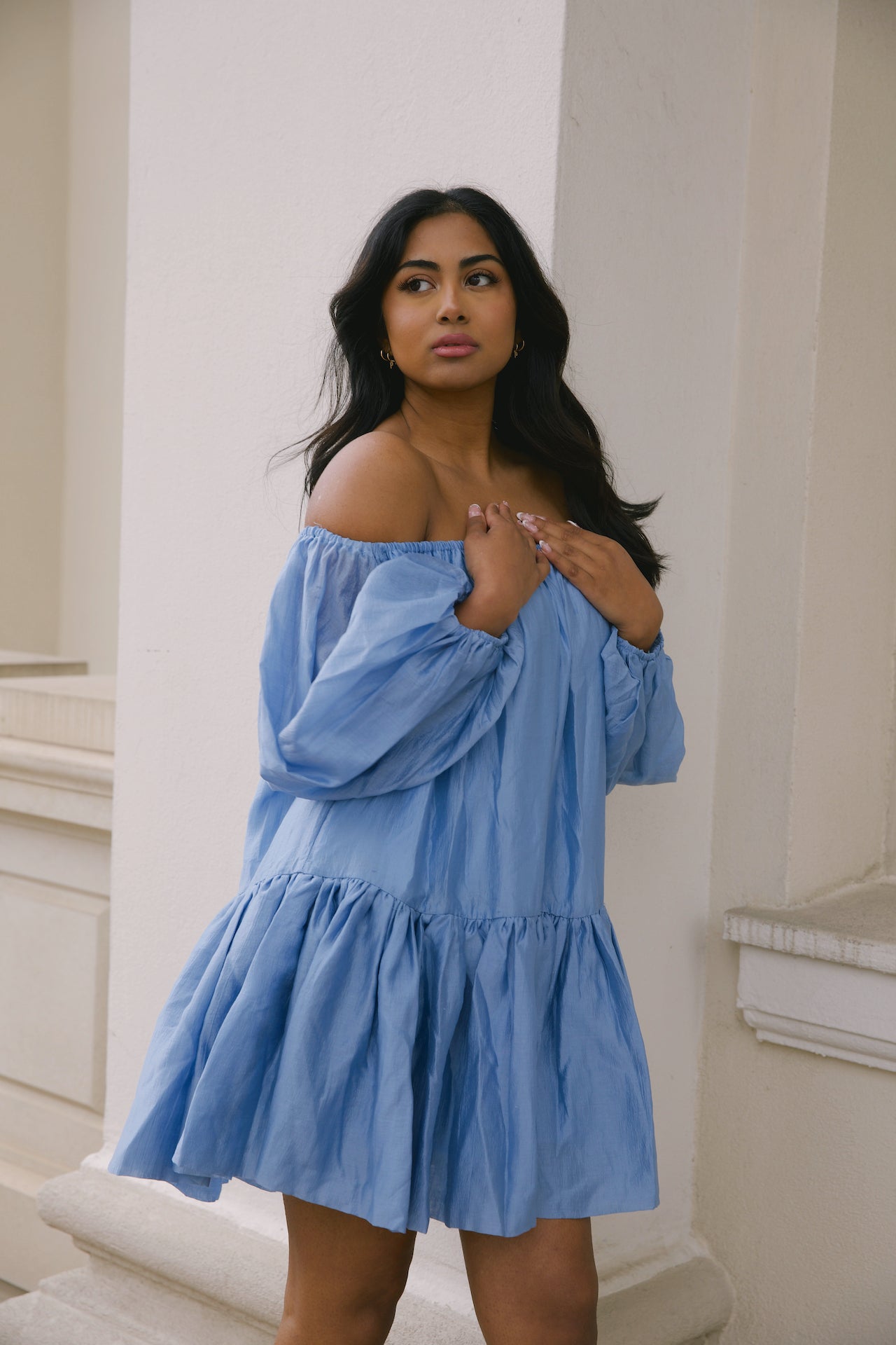 blue off the shoulder loose mini dress with puffy long sleeves and tiered skirt