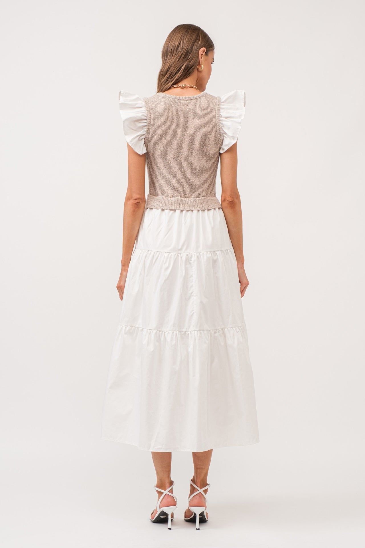 white flutter sleeve tiered midi dress with beige built in knit vest