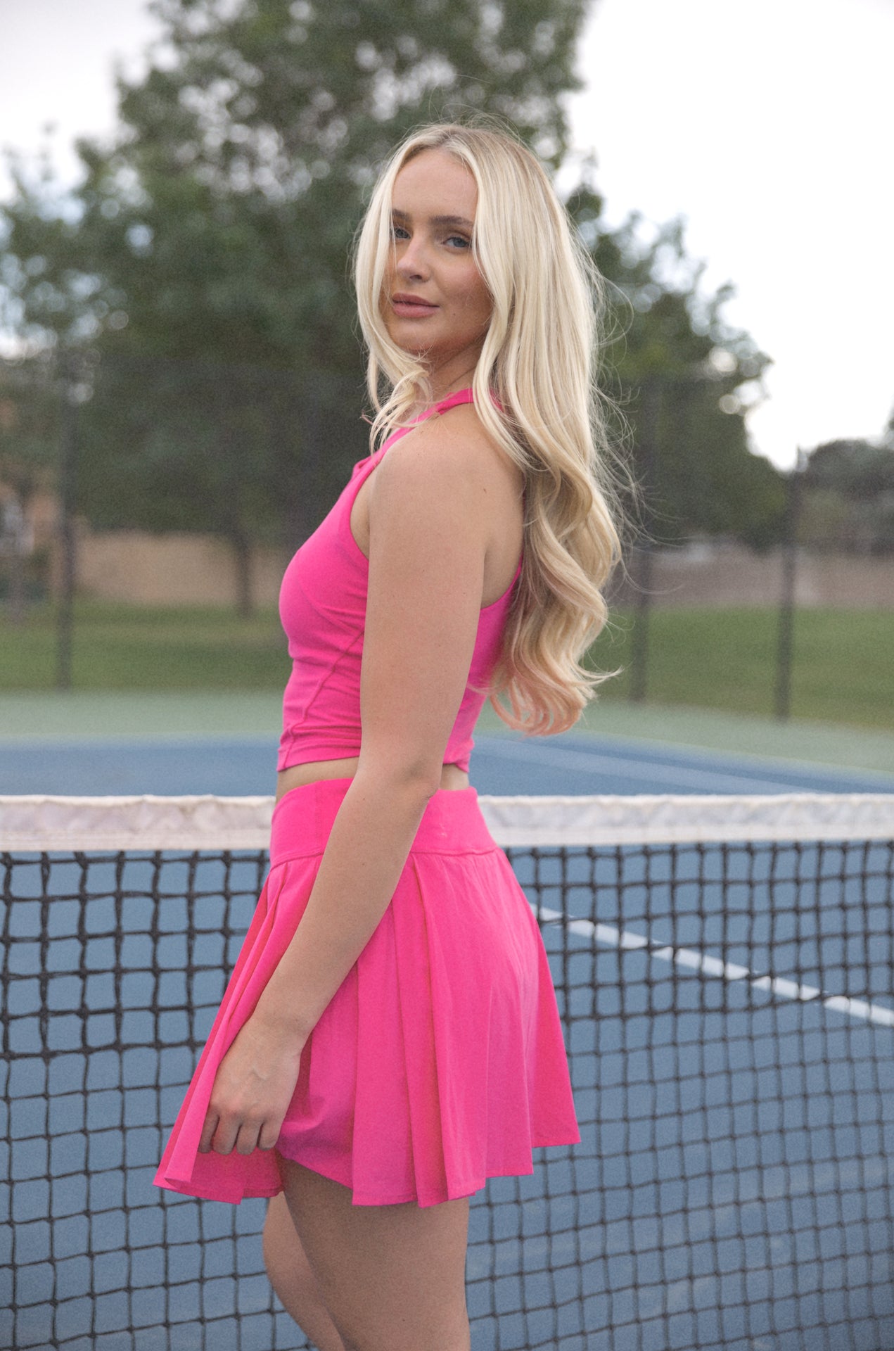 pink pleated golf mini skirt
