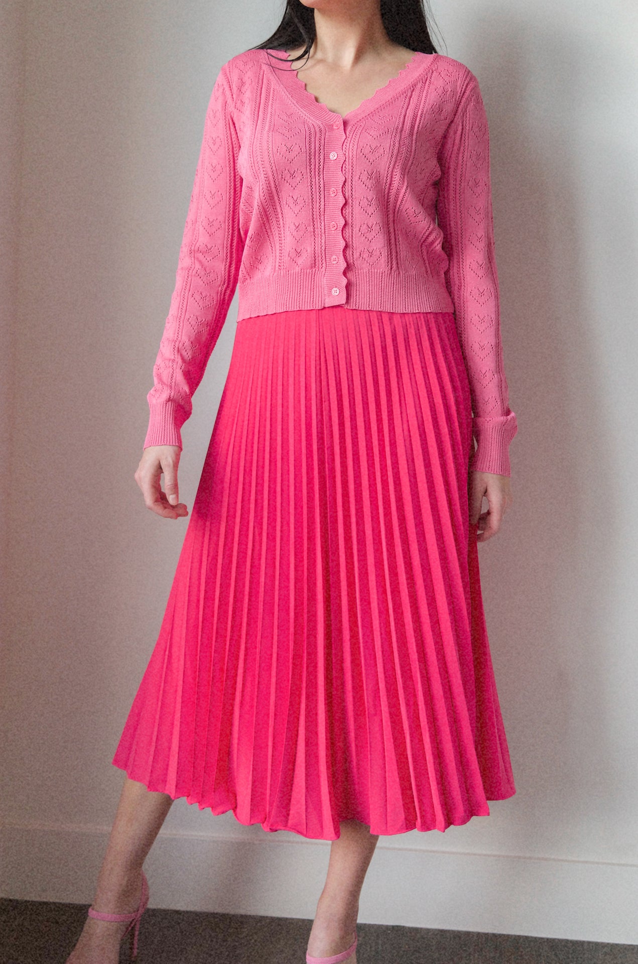 pink pleated midi skirt