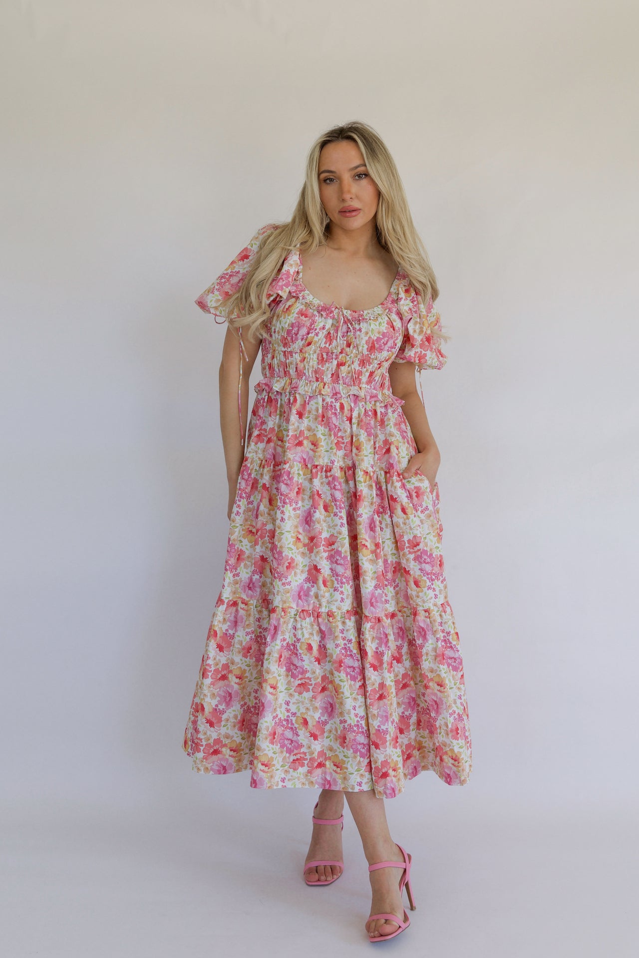pink floral tiered maxi dress with pockets and puff sleeves