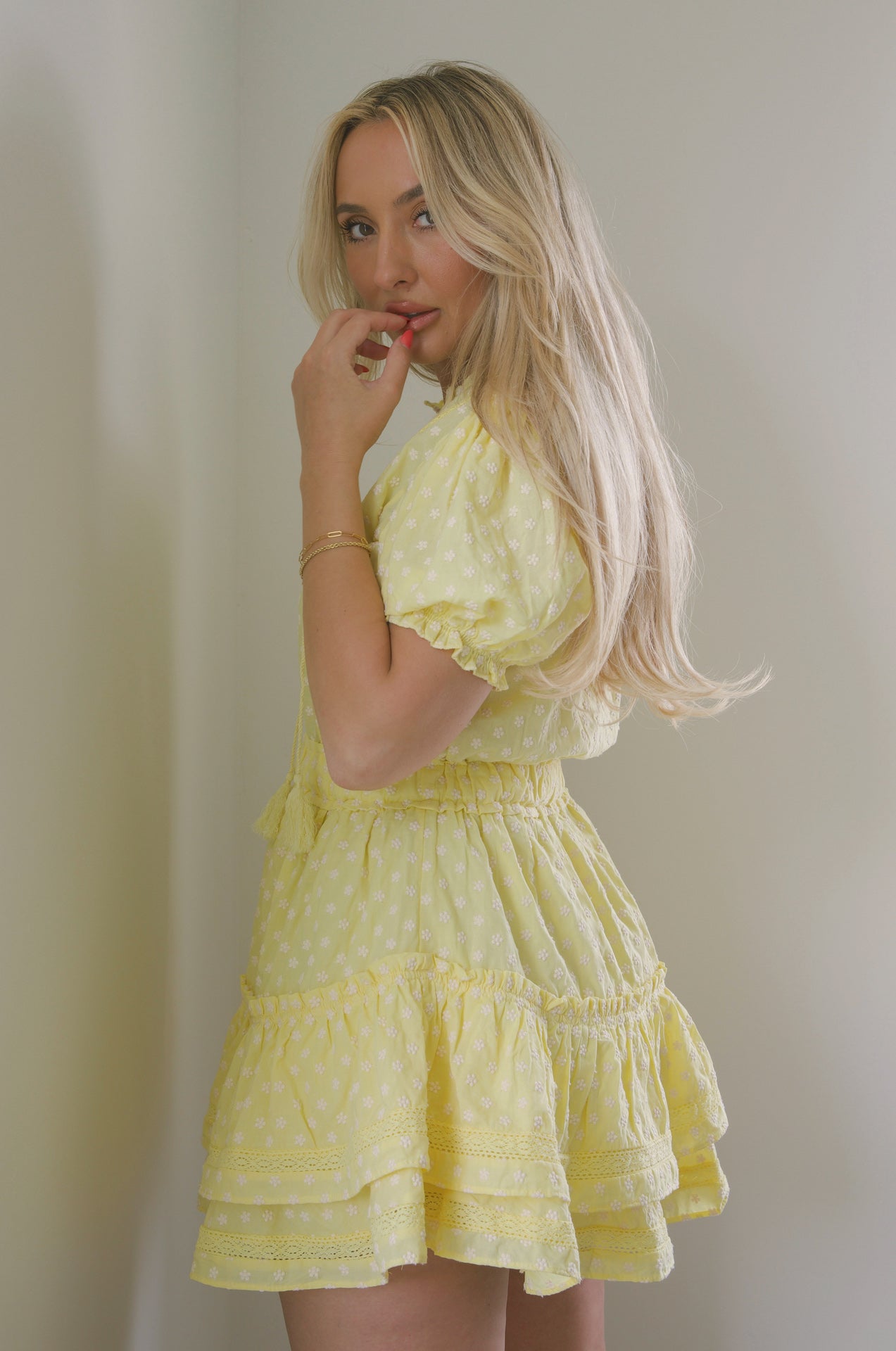 yellow embroidered ruffle tiered mini dress with embroidered floral print and lace trim detail