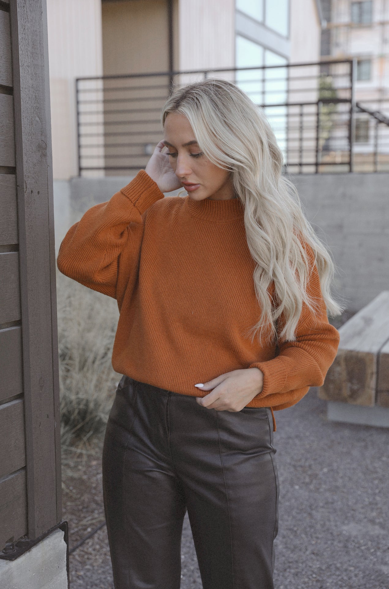 burnt orange camel knit sweater with an oversized fit