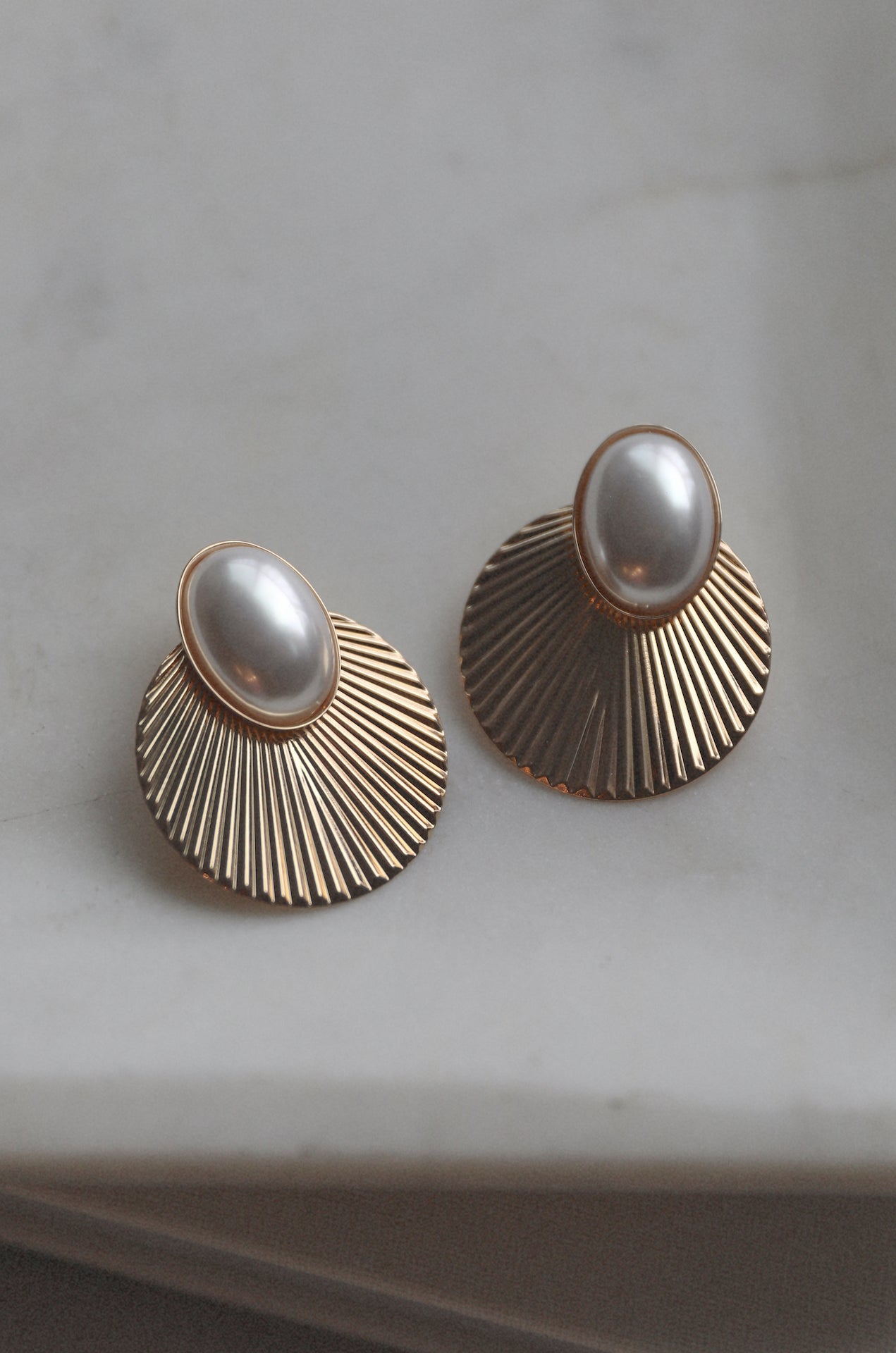gold seashell earrings with pearl