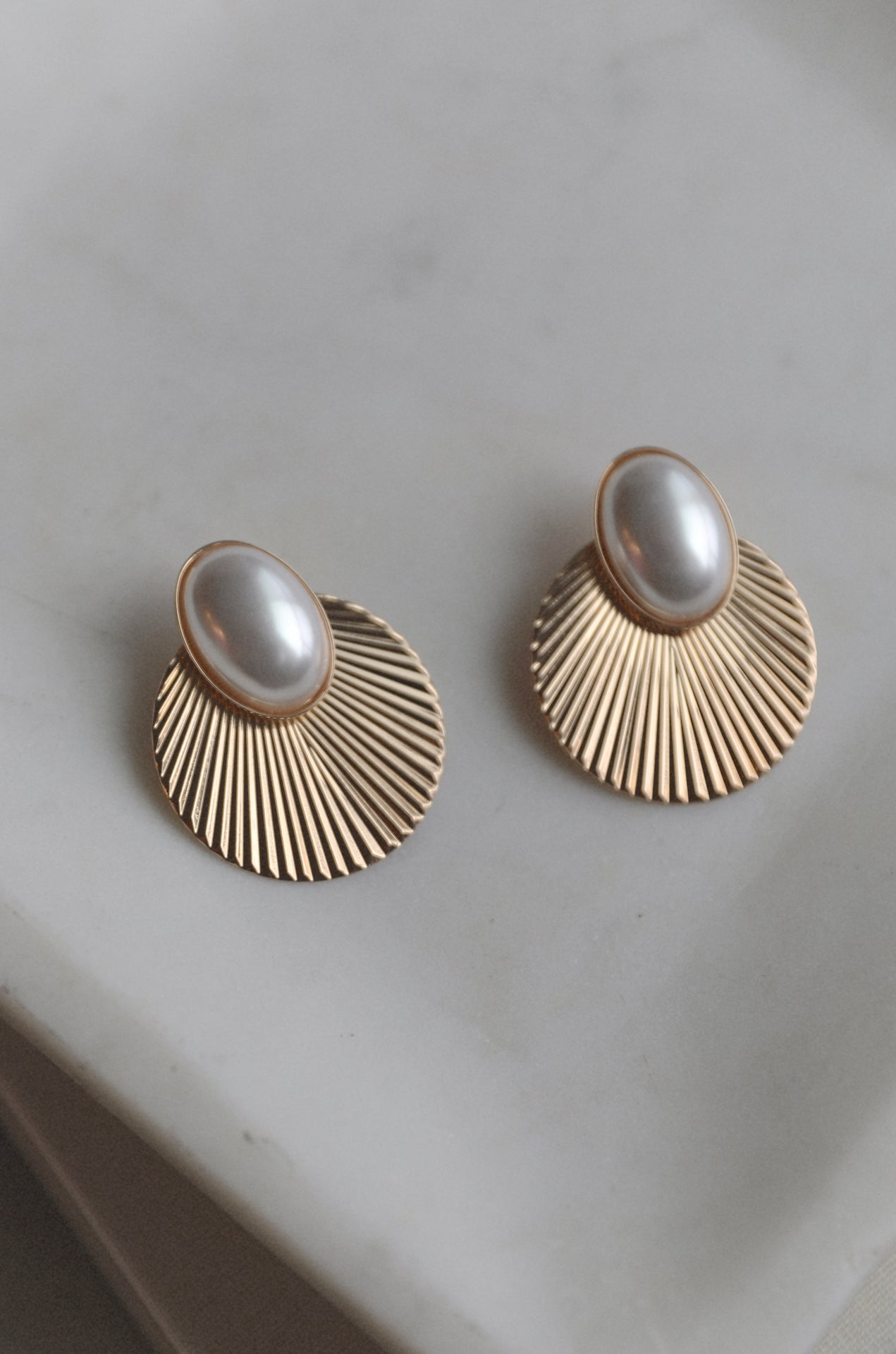 gold sunburst earrings with pearl