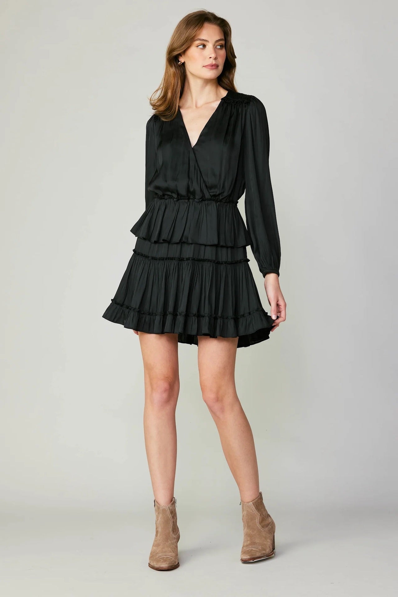 black tiered mini dress with long sleeves and pleated detail