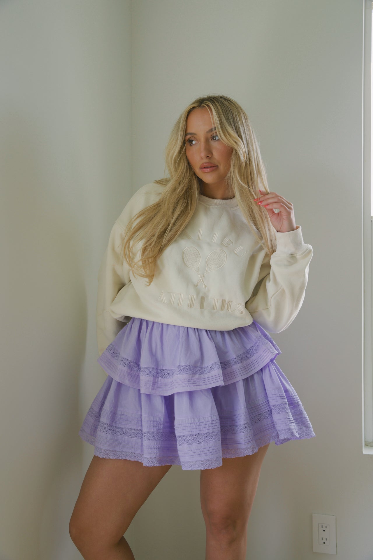 purple cotton tiered lace mini skirt with an elastic waistband