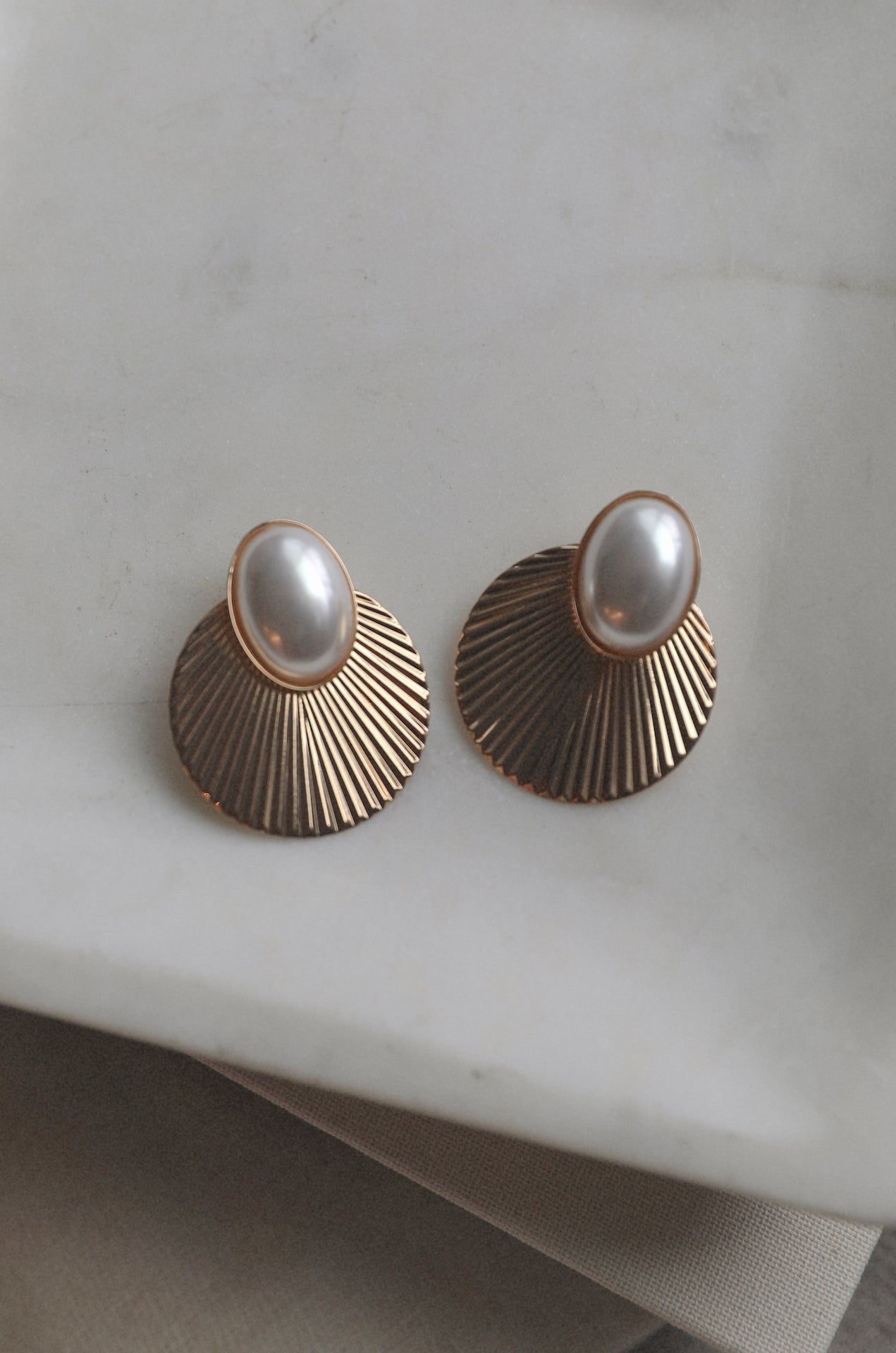 vintage inspired gold fan earrings with a pearl