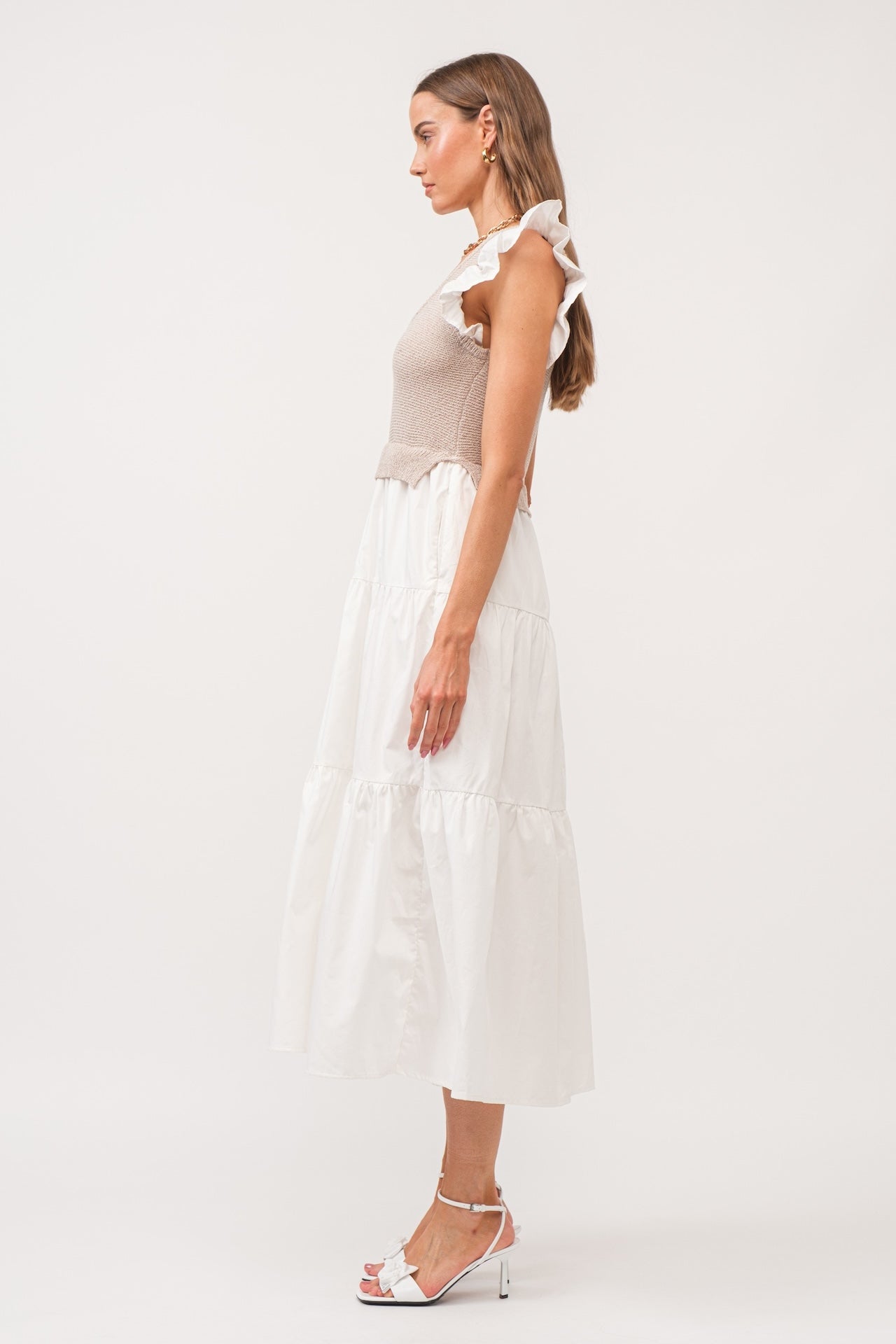 white flutter sleeve tiered midi dress with beige built in knit vest