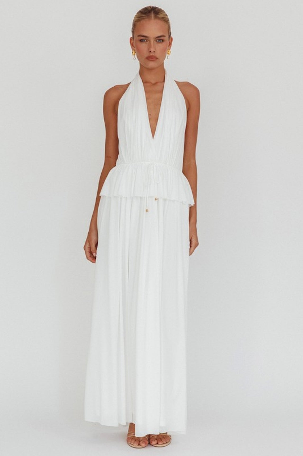 white halter maxi dress with peplum waist and open back