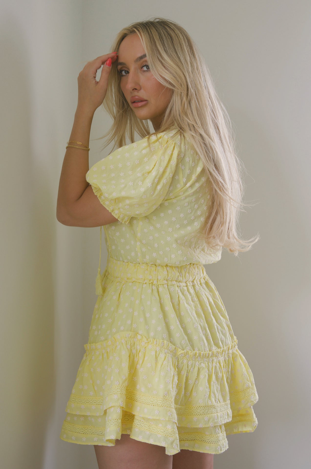 yellow embroidered ruffle tiered mini dress with embroidered floral print and lace trim detail