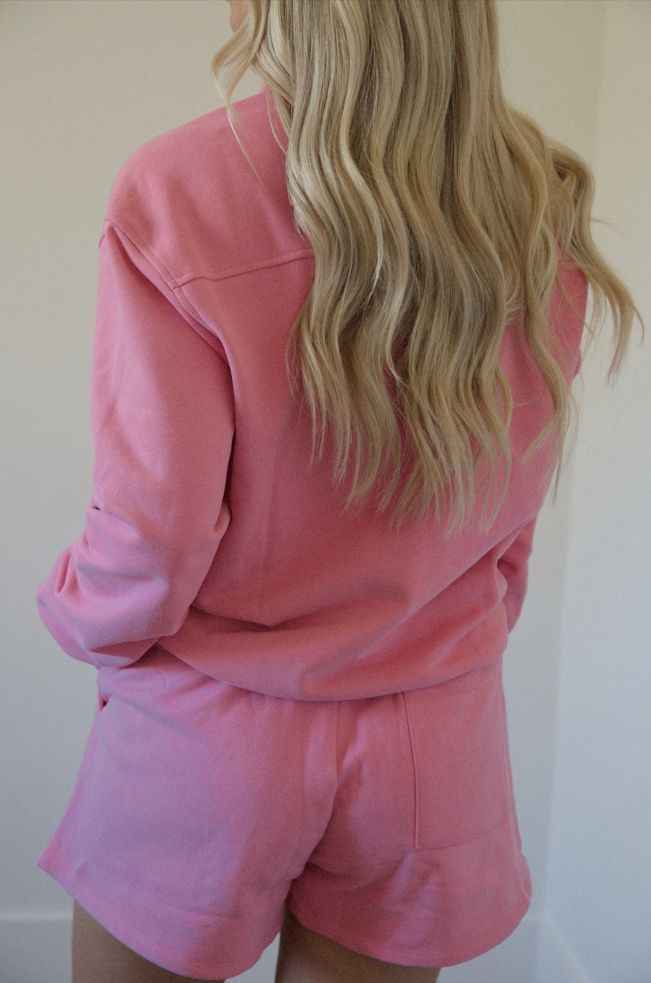 pink fleece sweatshirt and shorts set with a half zip pullover