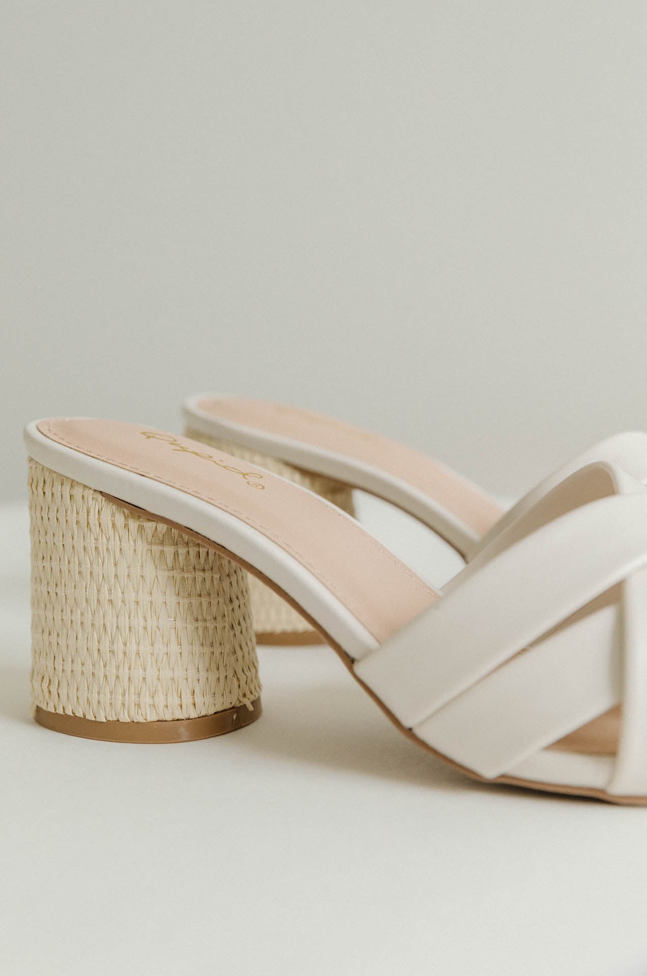 basket weave heels with a white criss cross design