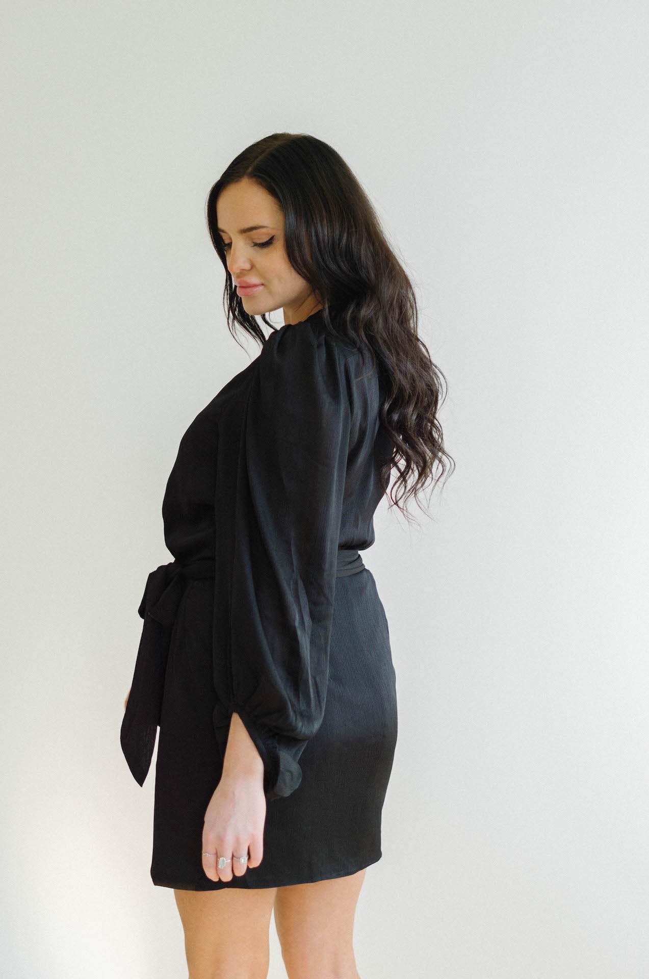 black wrap mini dress with long sleeves