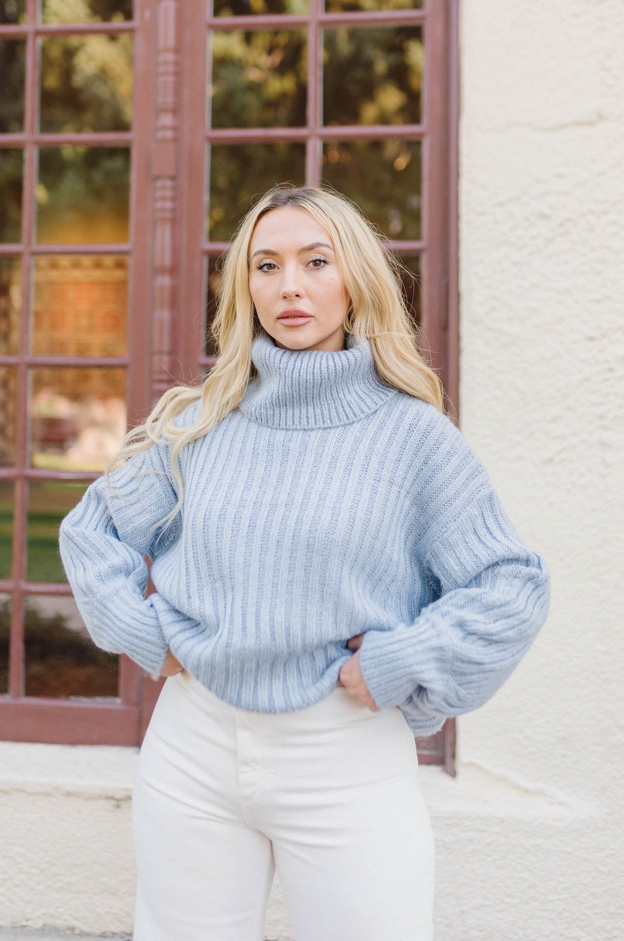 blue ribbed knitted turtleneck sweater with long sleeves