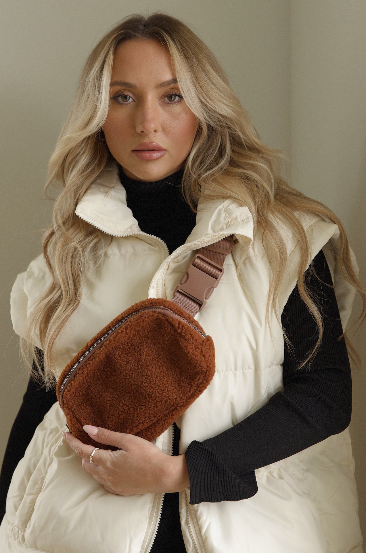 brown sherpa fleece crossbody belt bag that can be worn as a fanny pack