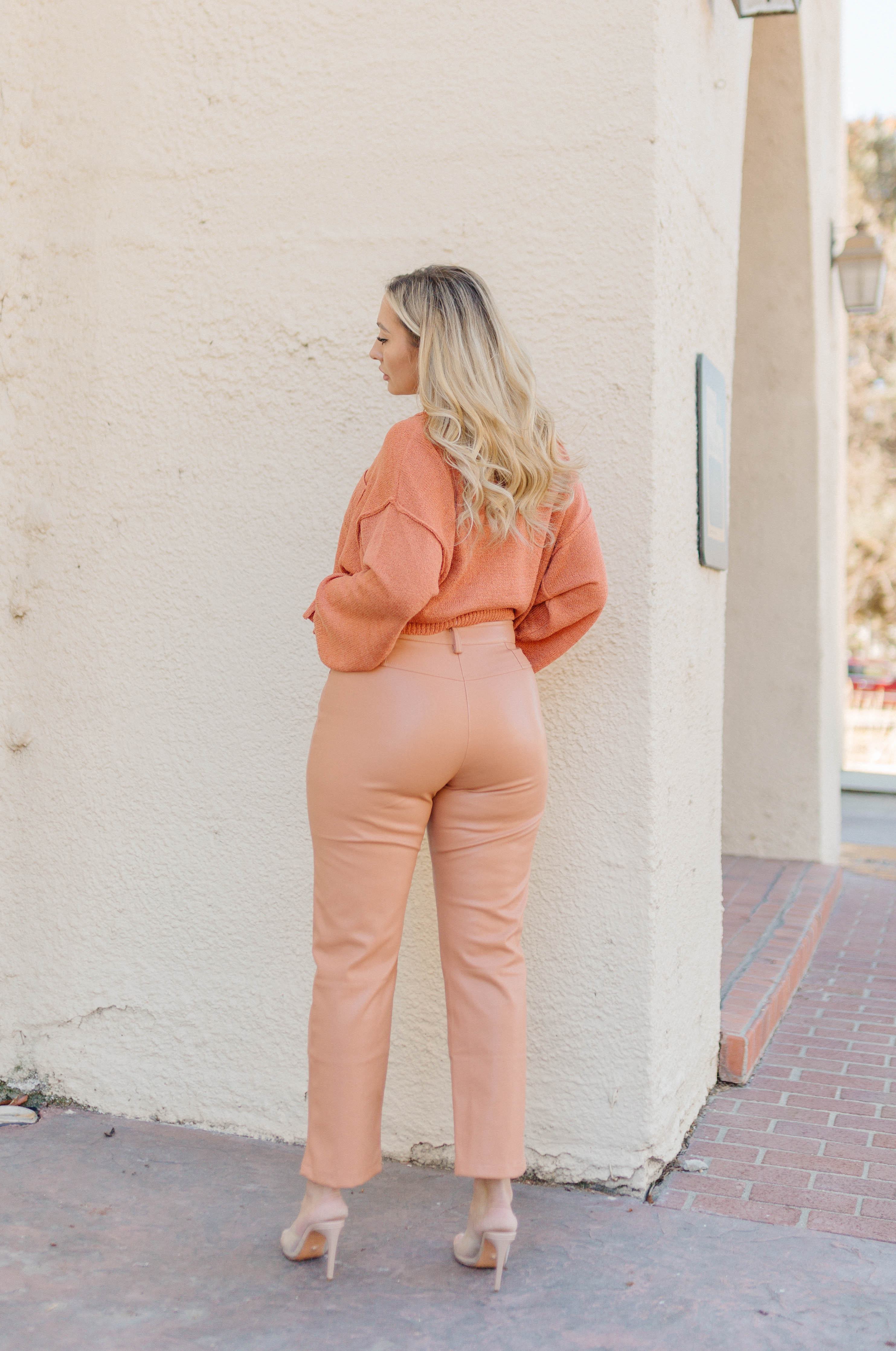 orange high waisted vegan leather pants 
