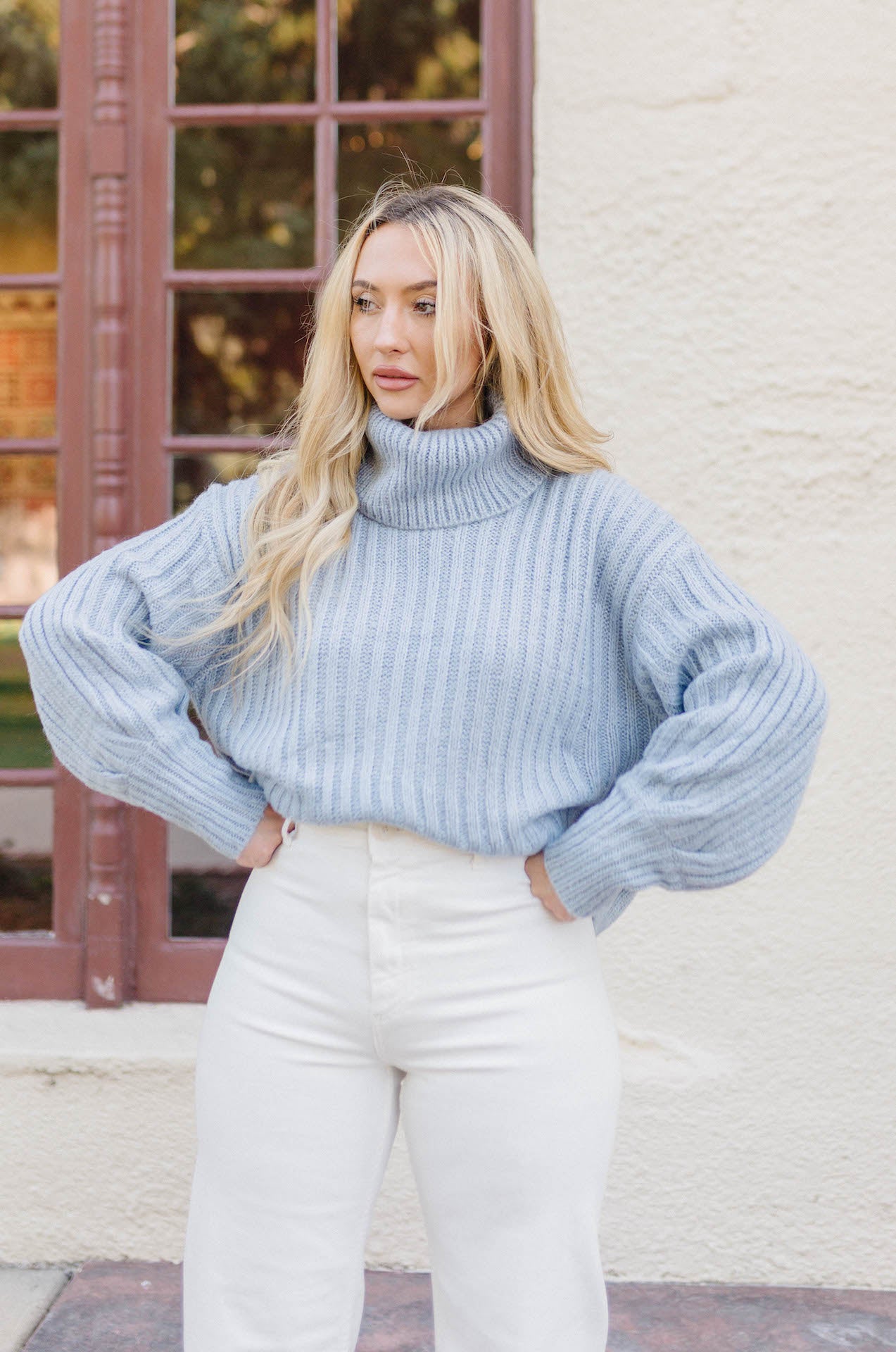 blue ribbed knitted turtleneck sweater with long sleeves