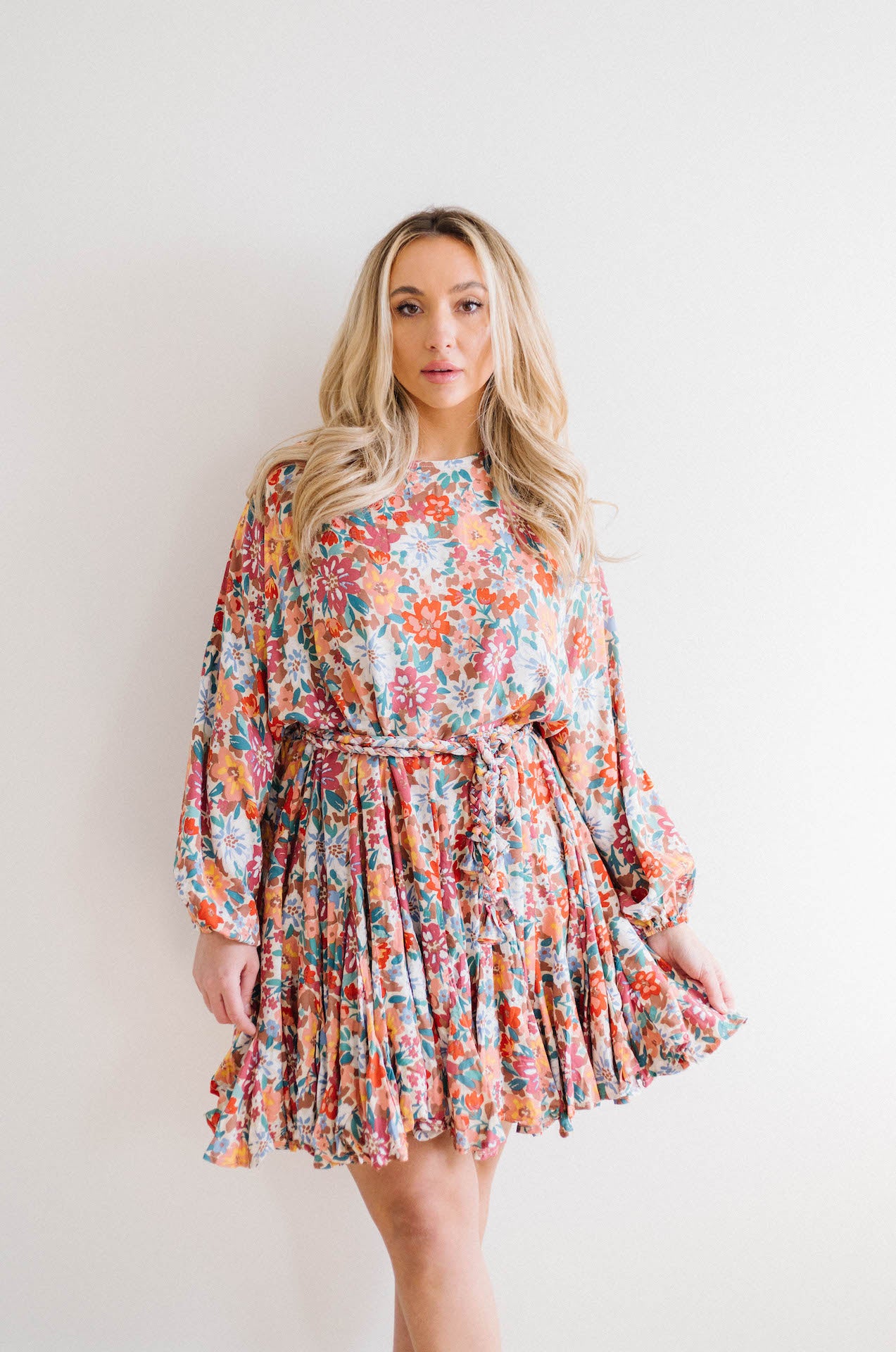 multicolor floral print dress with long sleeves and braided belt