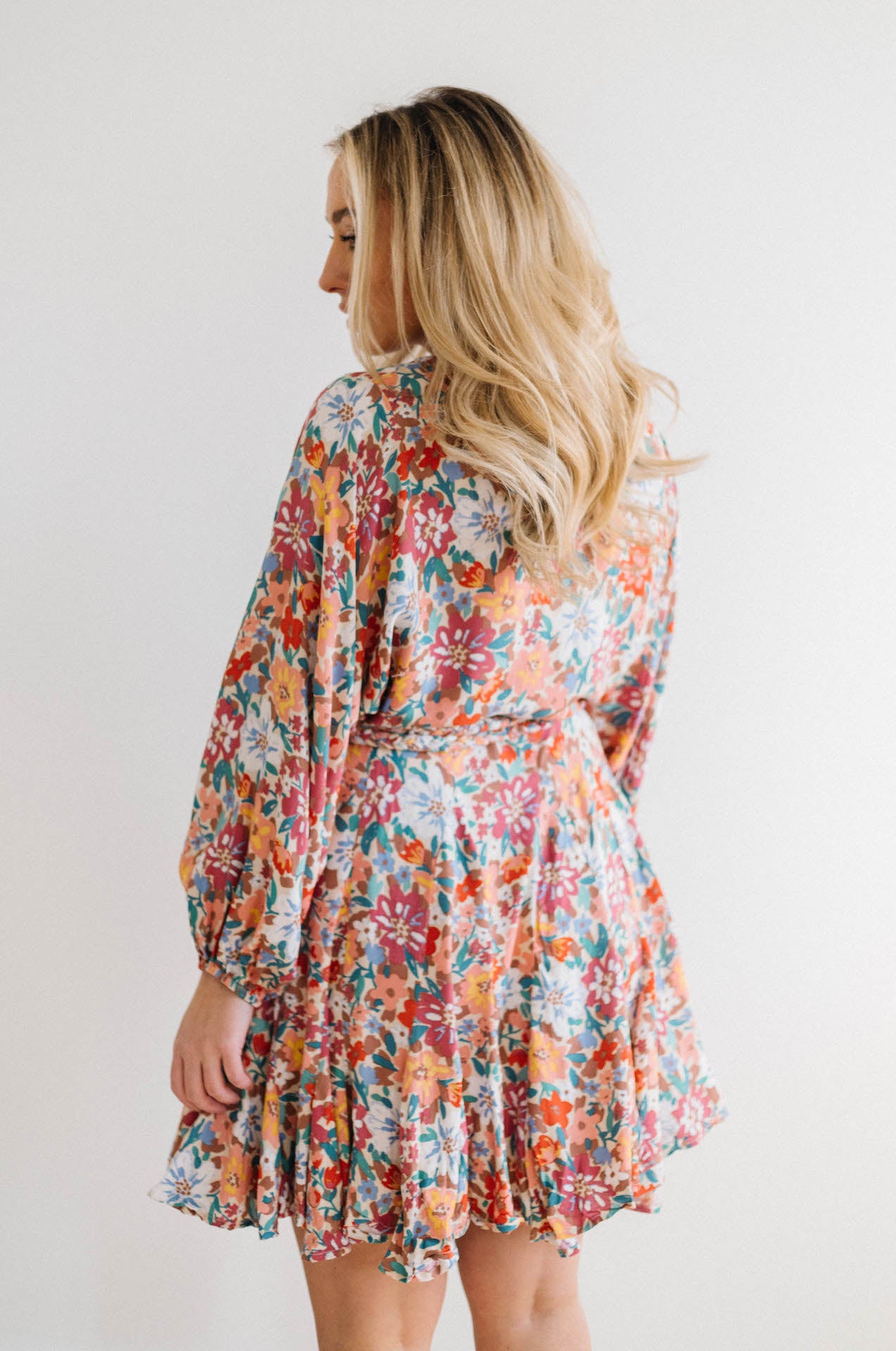 multicolor floral print dress with long sleeves and braided belt