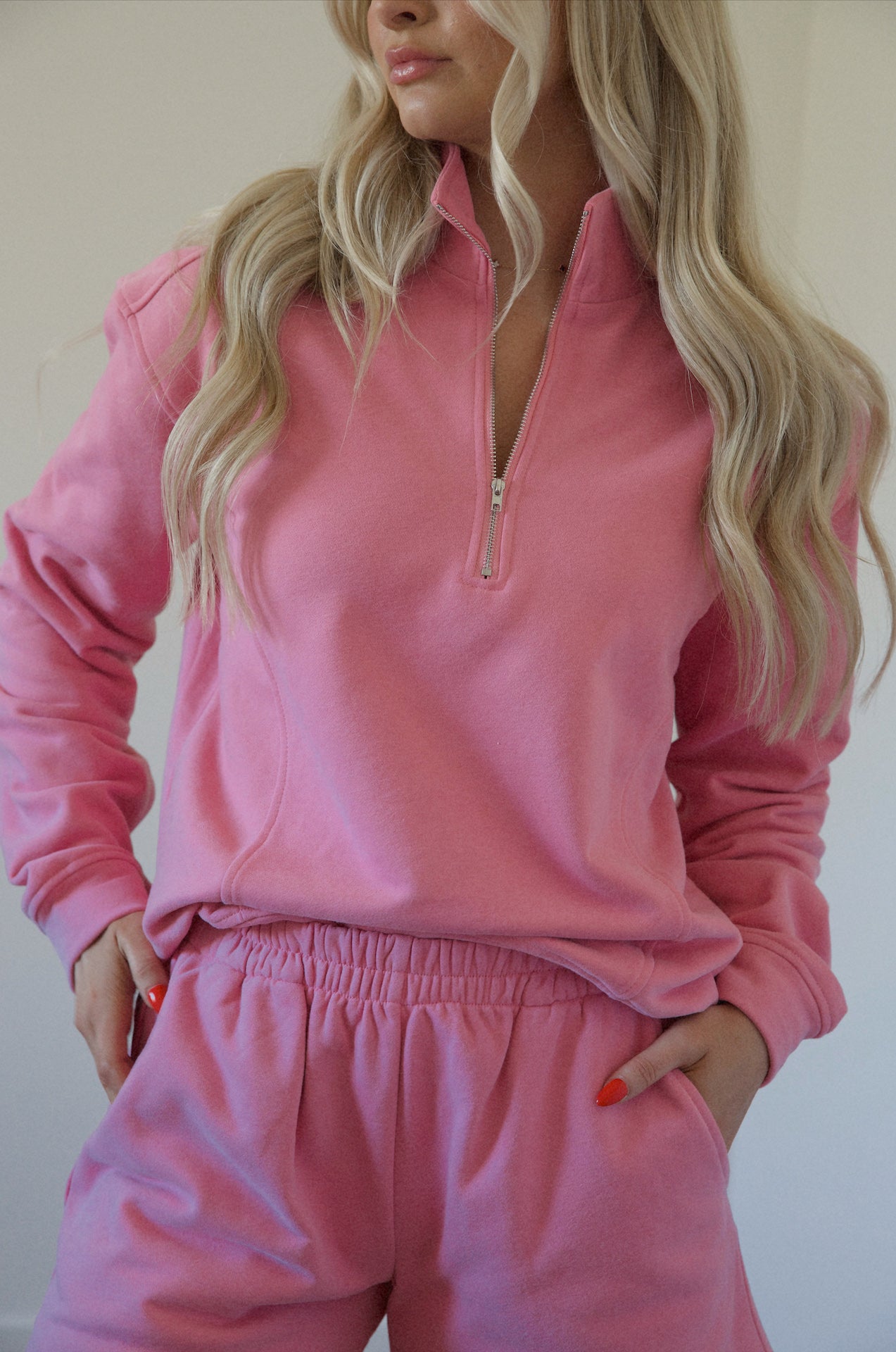pink fleece sweatshirt and shorts set with a half zip pullover