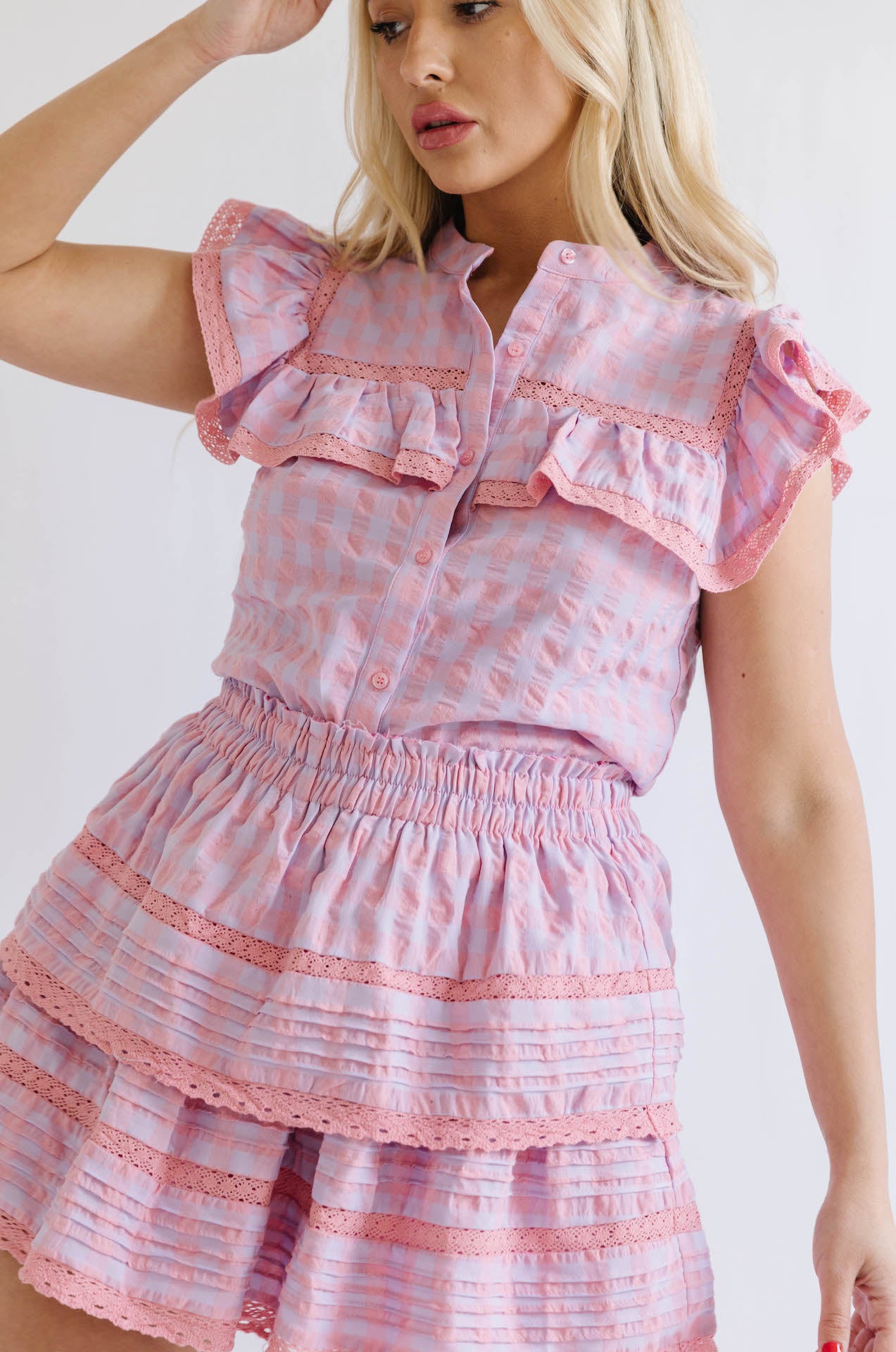 pink and purple button down top and ruffle mini skirt two piece set