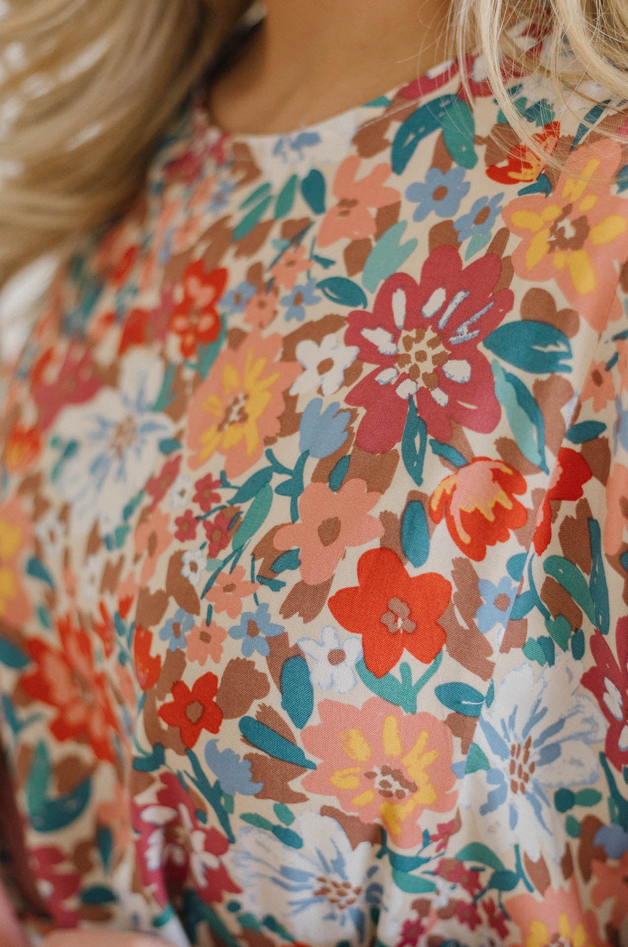 multicolor floral print dress with long sleeves and braided belt