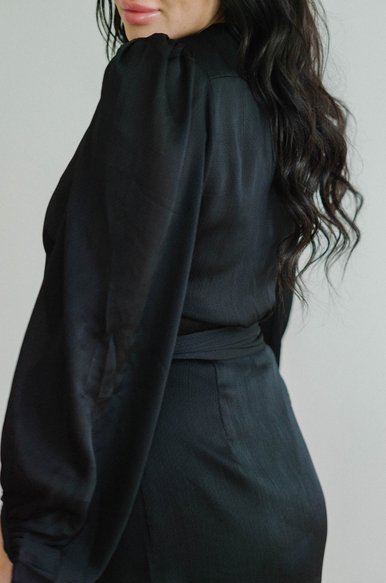black wrap mini dress with long sleeves