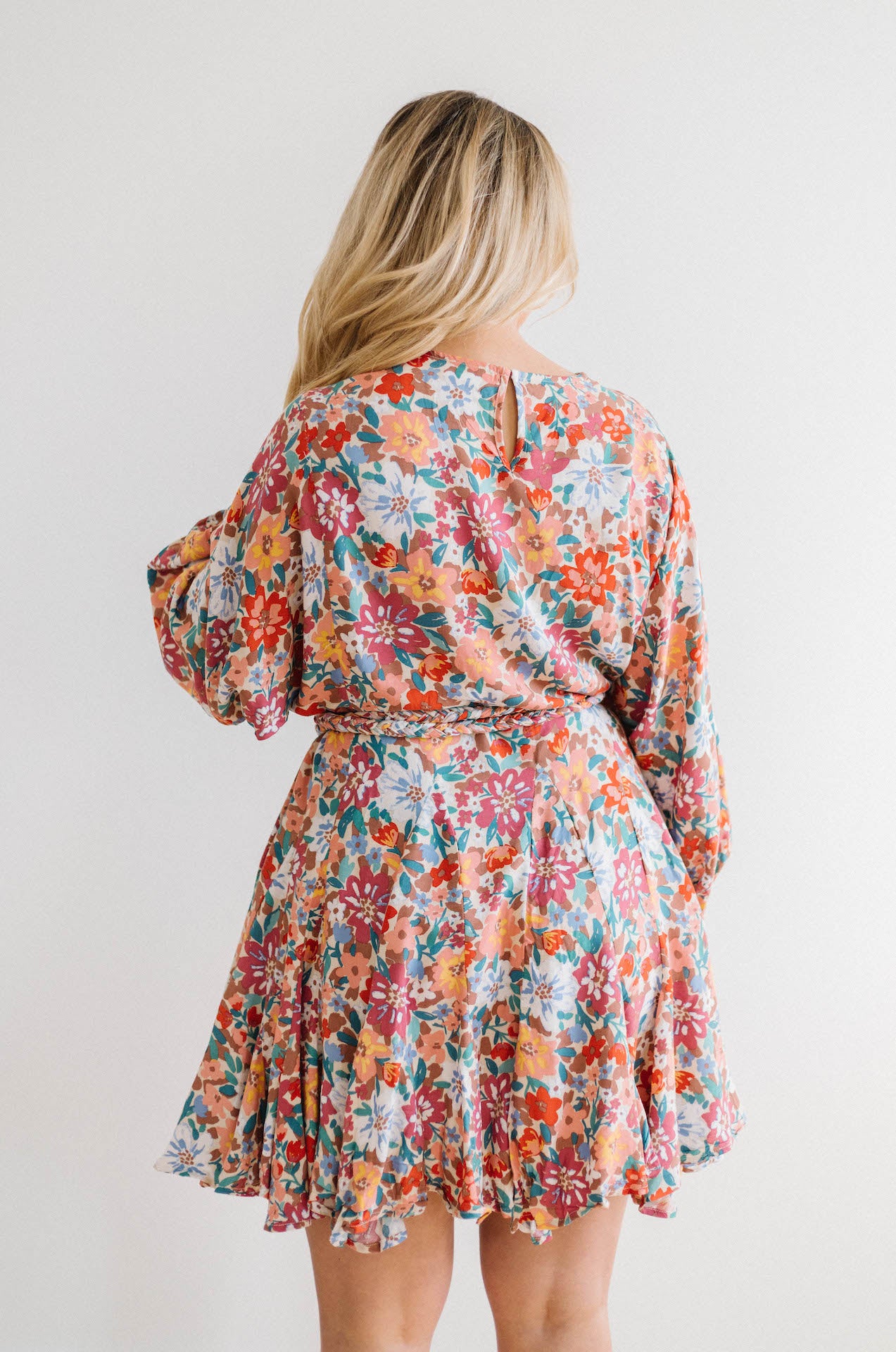 multicolor floral print dress with long sleeves and braided belt