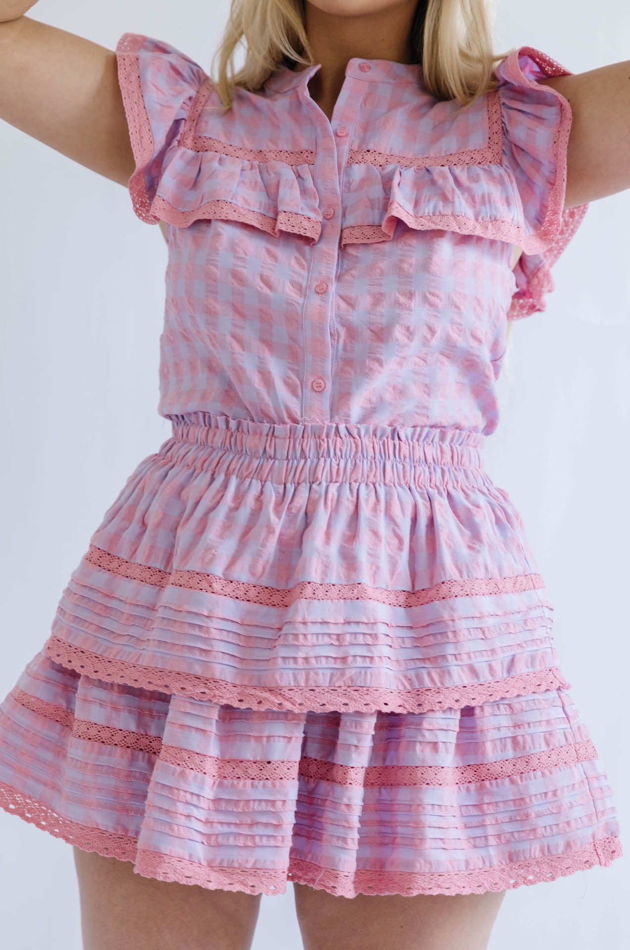 pink and purple button down top and ruffle mini skirt two piece set
