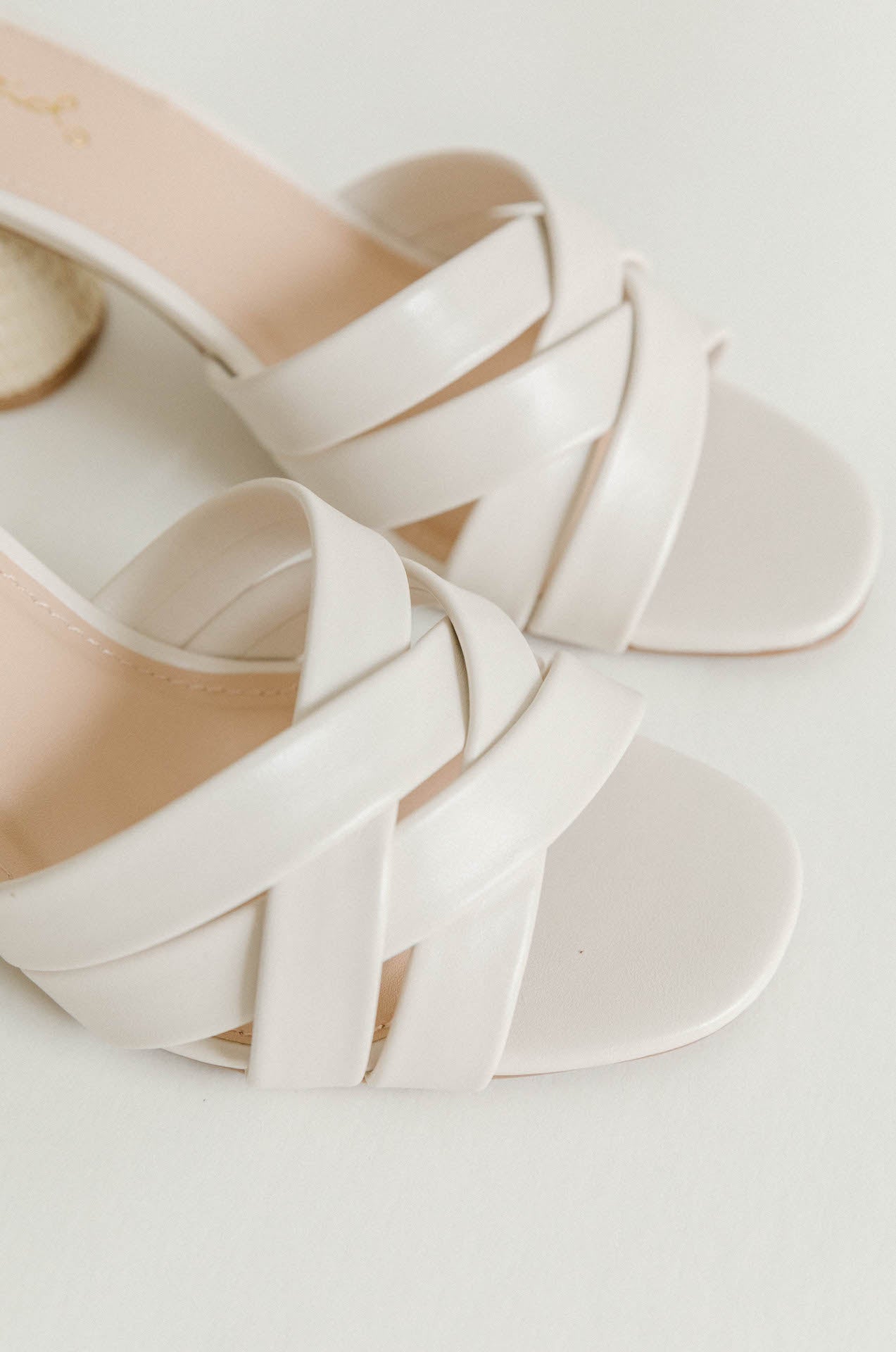 white criss cross woven heels