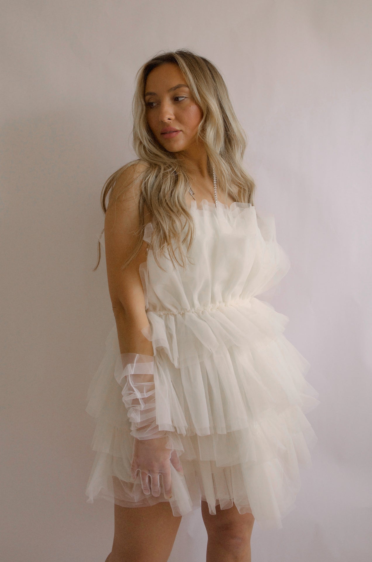 strapless tulle mini dress with a tiered cream organza