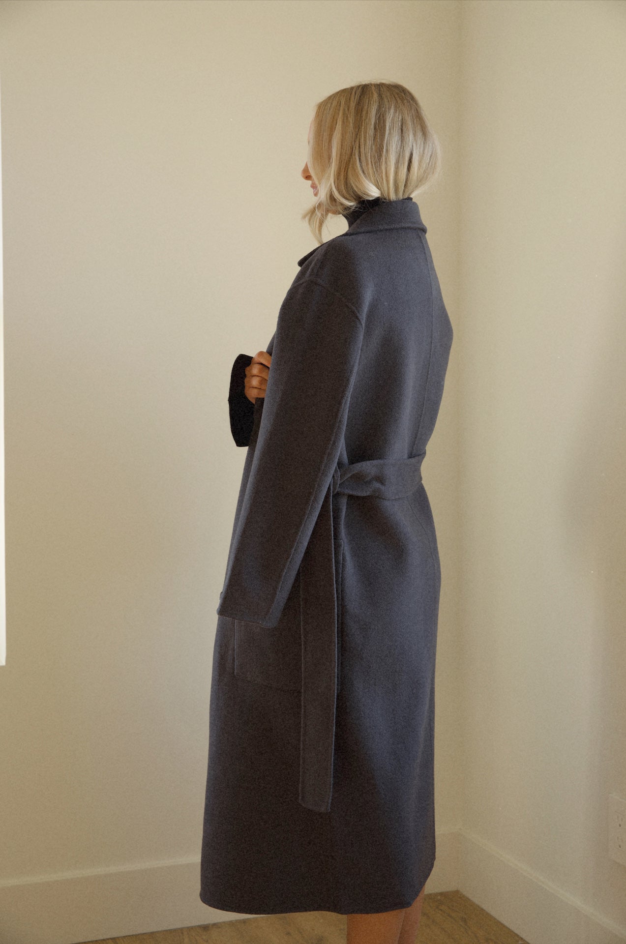 womens black wool coat that is belted with pockets